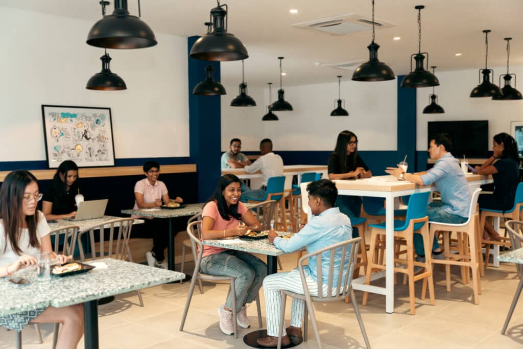 colleagues chatting in cafeteria 